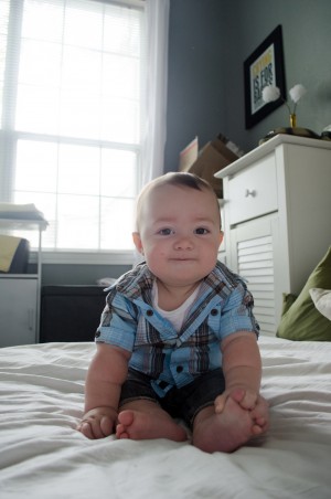 Miles - 9 Month baby photos - Smiling and grinning as he leans forward