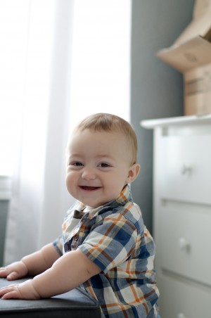 Miles - 9 Months Baby Photo - Showing off his standing skills and smiling