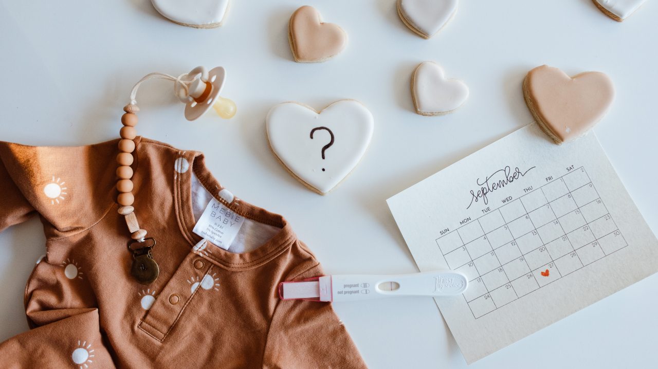 baby announcement flatlay