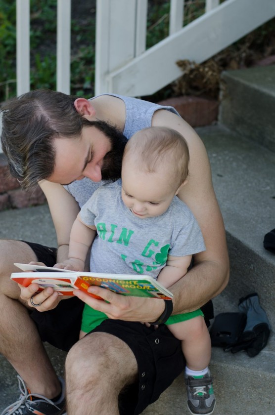 Finn and his daddy reading "Goodnight Moon" on the front porch one evening this spring.