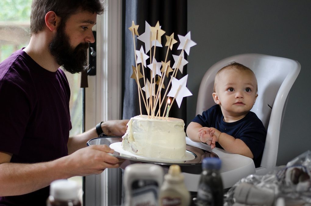 Steven bringing the cake over to Finn so he could blow out his first birthday candle.