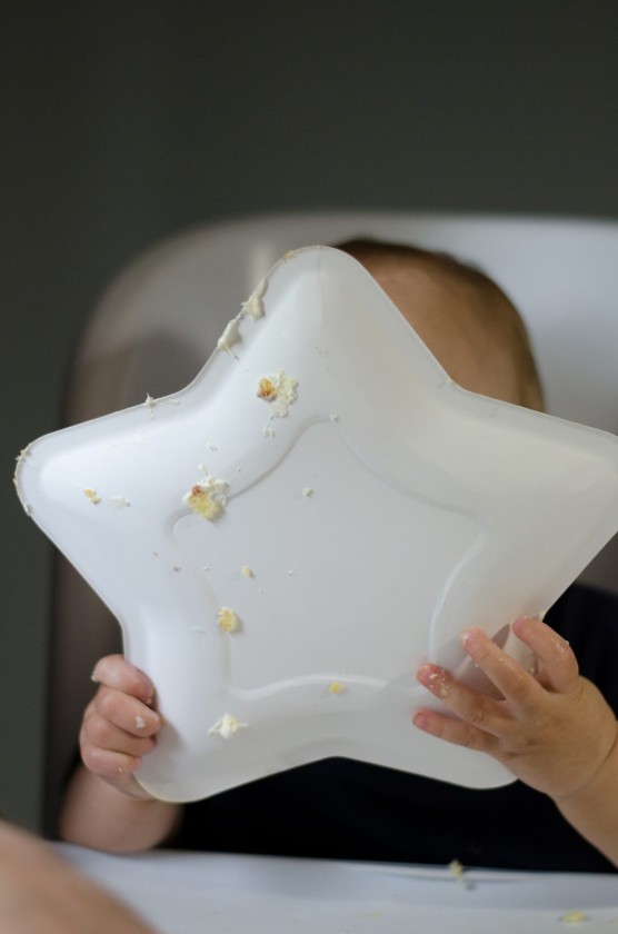 The back of Finn's star-shaped cake plate as Finn licks the plate clean