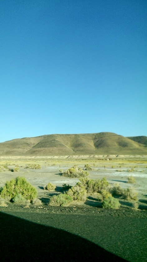 The Nevada desert landscape out the window while driving